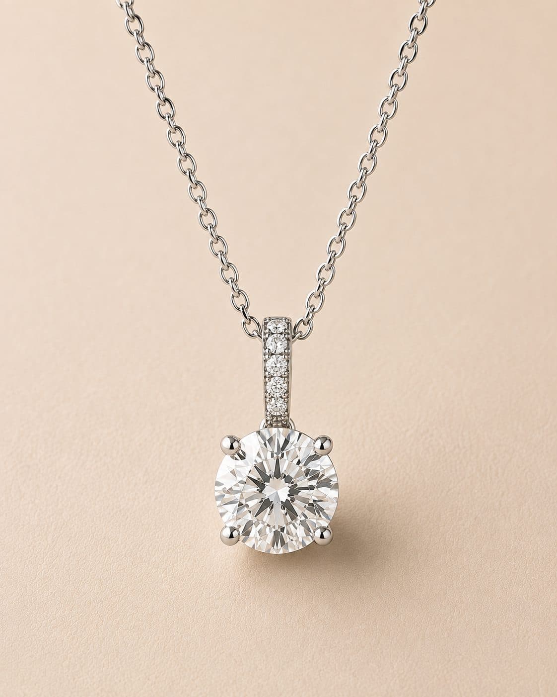 Brilliant-cut diamond pendant with pavé-set bail