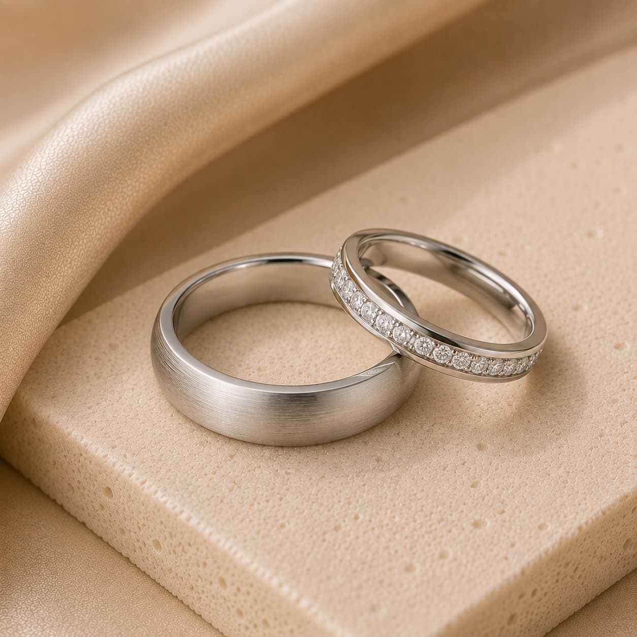 White gold bands, one set with a full diamond eternity band